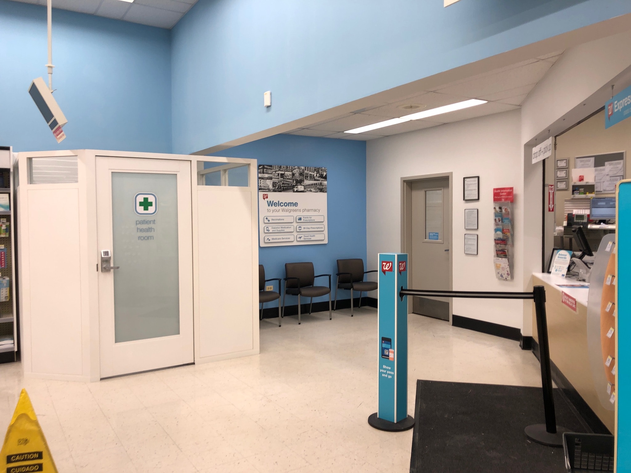 Walgreens pharmacy — completed patient health room with blue accent walls and new signage