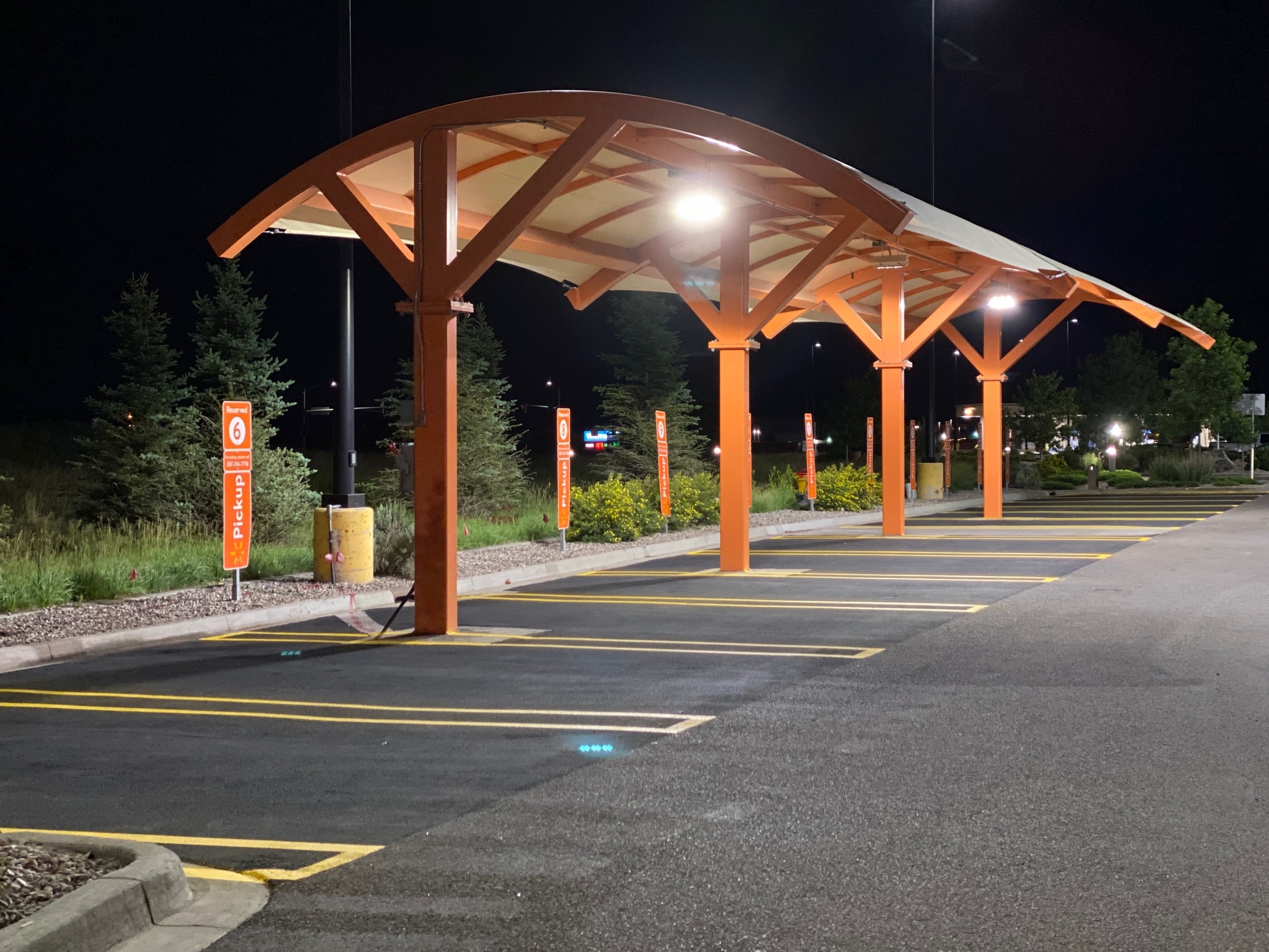 Walmart grocery pickup canopy and parking lot line striping — Cheyenne, WY