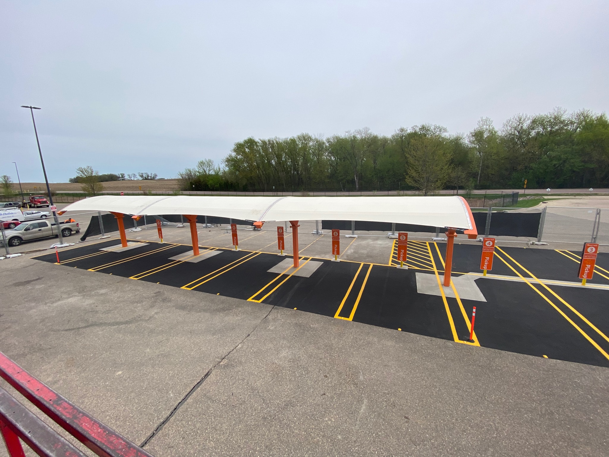 Walmart grocery pickup completed canopy and striping — Fairmont, MN